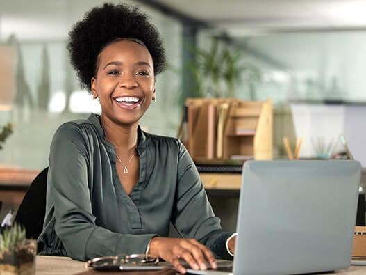 Woman using a laptop.